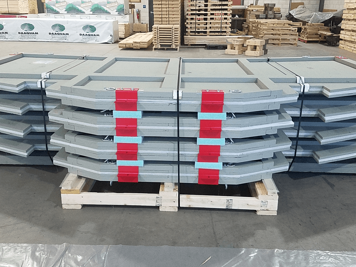 A rack of disassembled panels from a wood/steel container.
