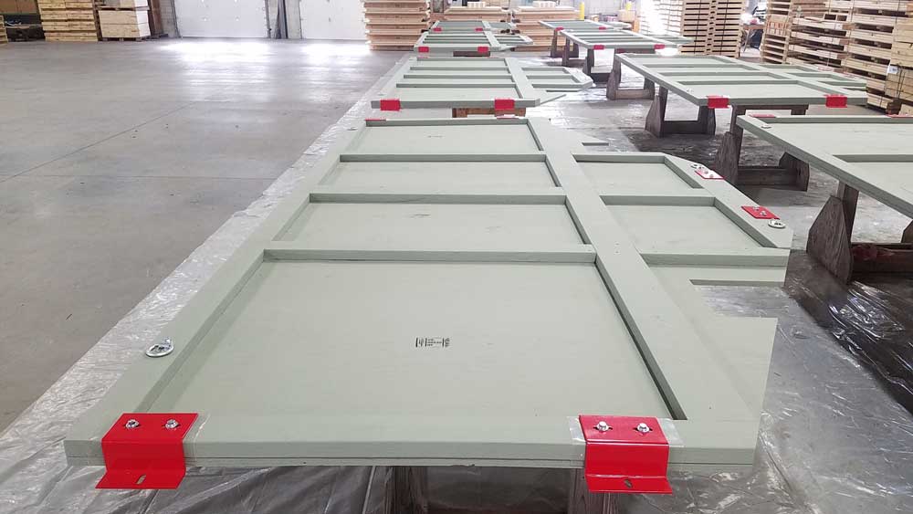 Closeup of a disassembled hybrid steel-wood panel.