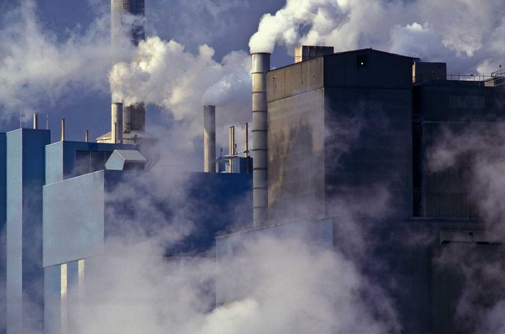 paper-manufacturing-plant-near-charleston-sc Paper manufacturing plant expels clouds of greenhouse gasses.